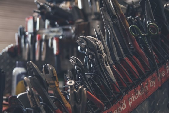 Hand tools arranged in a busy repair workshop