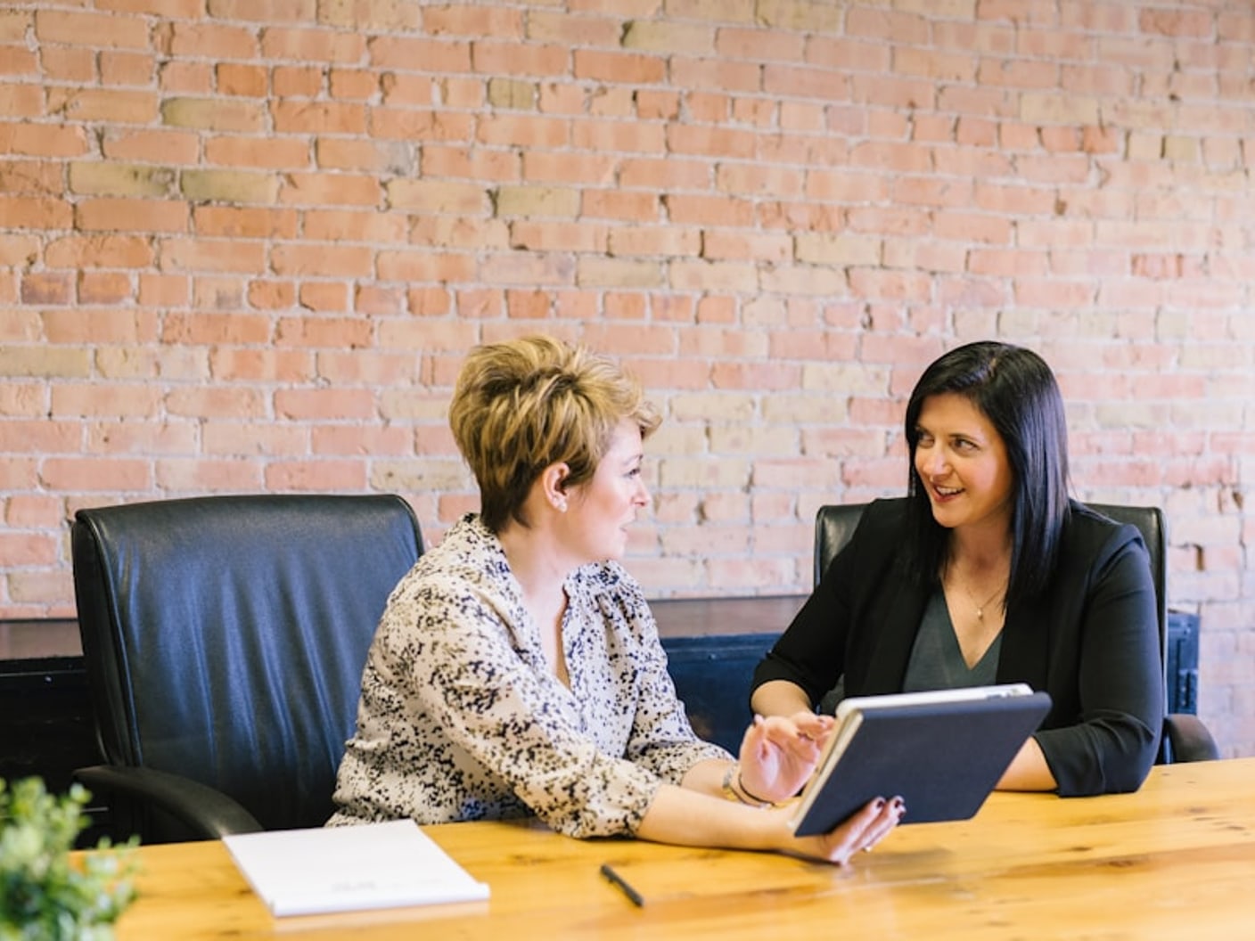 An attorney reviewing next steps with a client across an office table